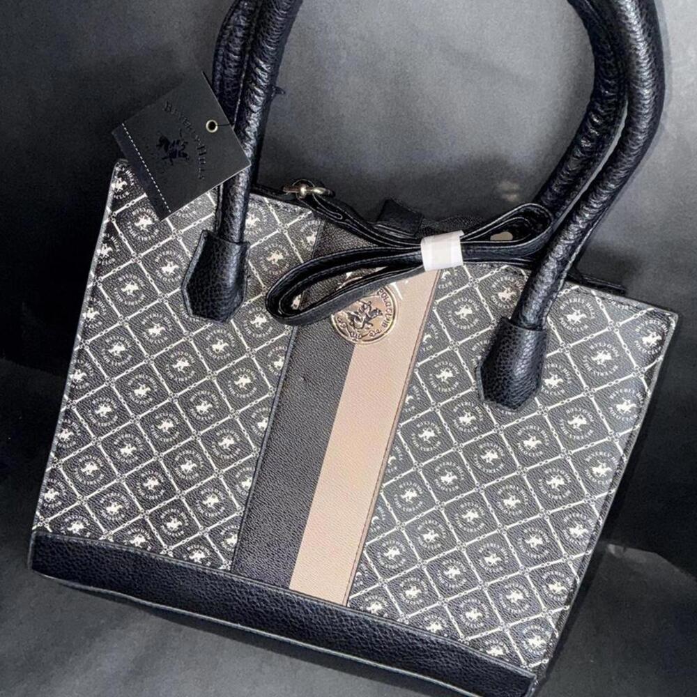 Black leather handbag with a unique design #luxury #leathergoods